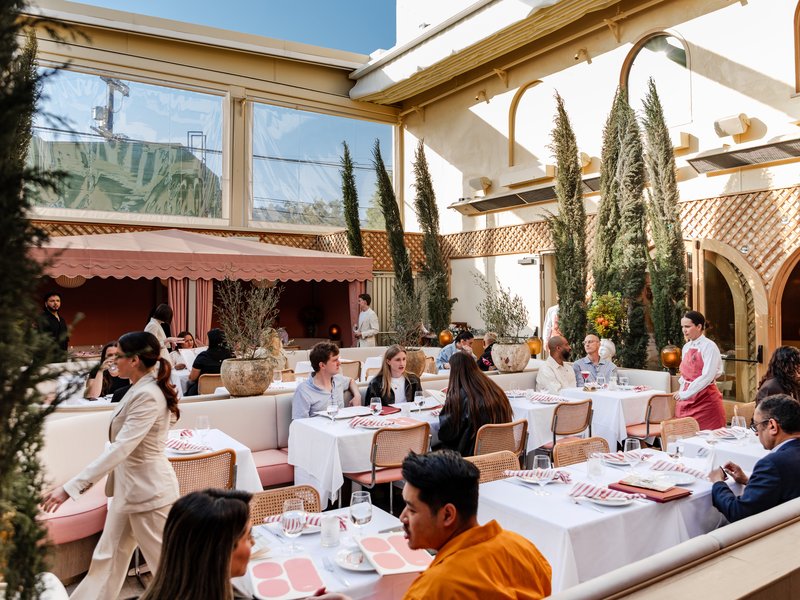 A bustling LA restaurant patio at golden hour